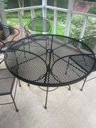 Wrought iron table with four chairs