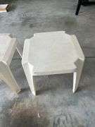 Three plastic end tables