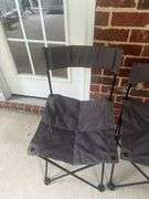 Two folding bag chairs in one bag and a sleeping bag.