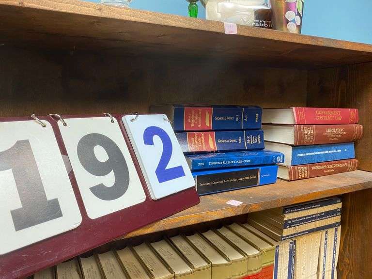 LAW BOOKS ON 2ND SHELF OF BOOKCASE image