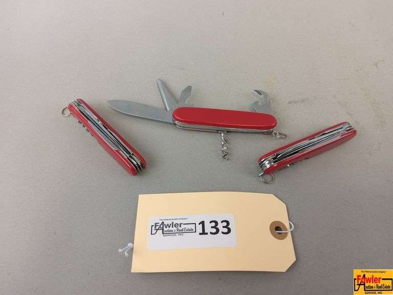 Group of Three Red Multi-Tool Pocket Knives image