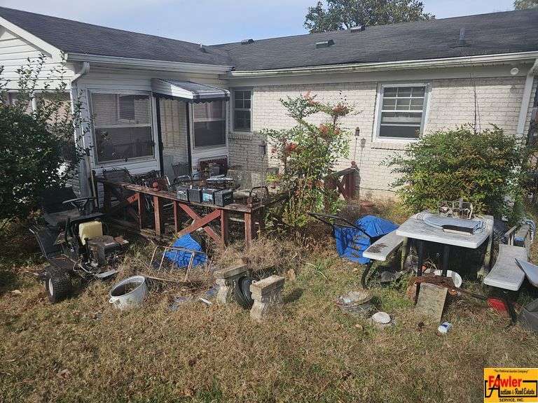 Contents of Back Porch to include a Picnic Table, Outdoor Furniture, and More image