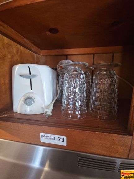 Contents of Cabinet: Toaster, Glasses image