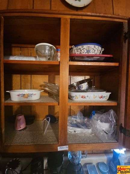 Contents of Cabinet: Measuring Cup, Casserole Dishes & More image