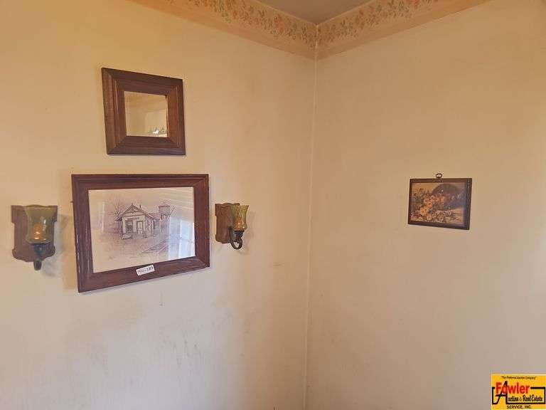 Framed Art, Wall Sconces, and Small Mirror image