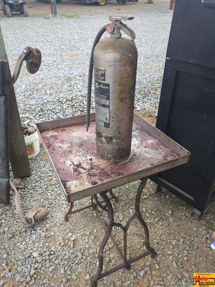 Metal Table With Fire Extinguisher image