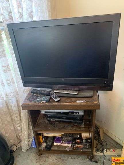 Flat Screen Television With Stand & Contents image