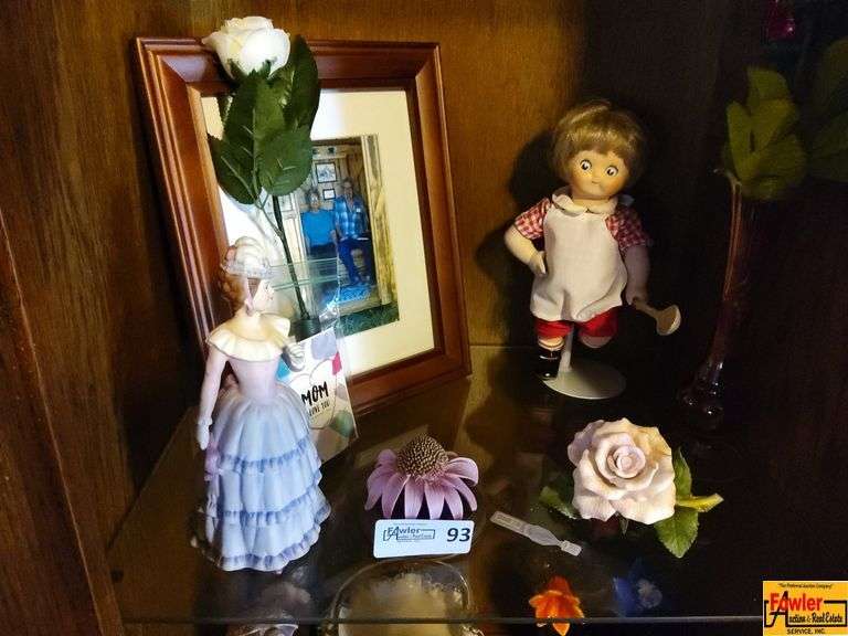 Contents of Shelf in Entertainment Center: Faux Flowers, Figurine, Doll (Family Photo Not Included) image