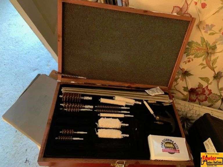 Contents On Chair:  gun cleaning kit, clothing & more image