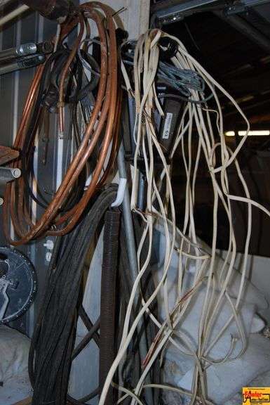 Assorted Electrical Wire, Copper Tubing, and Outdoor Light Fixture image