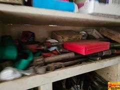Shelving Unit Contents Including Assorted Parts, Tools, and Oil
