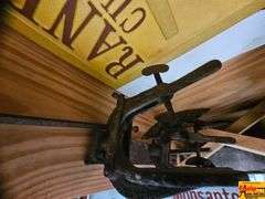 Collection of Advertising Signs, Tools, and Equipment