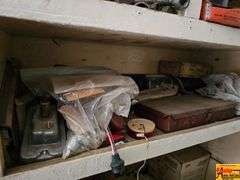 Shelving Unit Contents Including Assorted Parts, Tools, and Oil