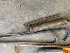 Assorted Tools: Grease Guns and Pry Bars