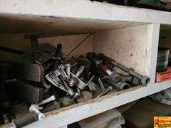 Shelving Unit Contents Including Assorted Parts, Tools, and Oil