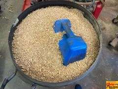 Husqvarna Brute Rolling Container with Wood Shavings