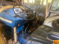 Ford 4000 Tractor with Loader and Bobcat Backhoe Attachment (running condition when stored)