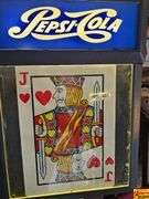 Pepsi-Cola Sign, Winston Calendar, and Jack of Hearts Display