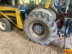 Ford 4000 Tractor with Loader and Bobcat Backhoe Attachment (running condition when stored)