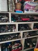 Shelving Unit Contents Including Assorted Parts, Tools, and Oil