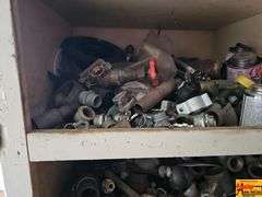 Shelving Unit Contents Including Assorted Parts, Tools, and Oil