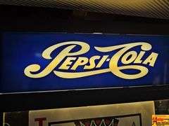 Pepsi-Cola Sign, Winston Calendar, and Jack of Hearts Display