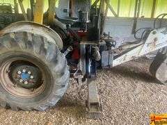 Ford 4000 Tractor with Loader and Bobcat Backhoe Attachment (running condition when stored)