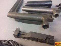 2 Triggers, 2 Bolts, 2 Springs, 2 Trigger Covers