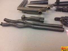 2 Triggers, 2 Bolts, 2 Springs, 2 Trigger Covers