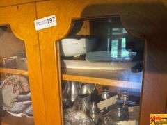 Contents Of Cabinet:  Metal Pitcher & Tea Pot, Glass Stemware