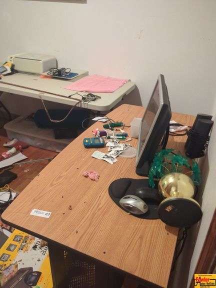 Contents Of Room:  display case, folding tables, printer, display monitor with mouse