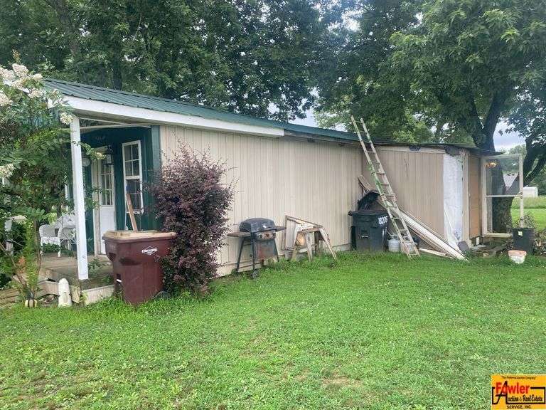 Metal Utility Shed/Outbuilding.  Buyer is responsible for disassembling & removing. image