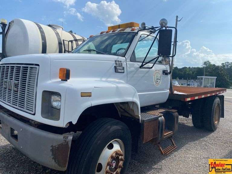 1999 GMC 7500 Flatbed Truck; 80,634 Miles; VIN 1GDM7H1C0XJ505041.  See video.