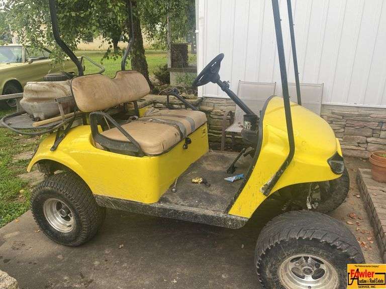 Yellow Golf Cart with Sprayer Tank image