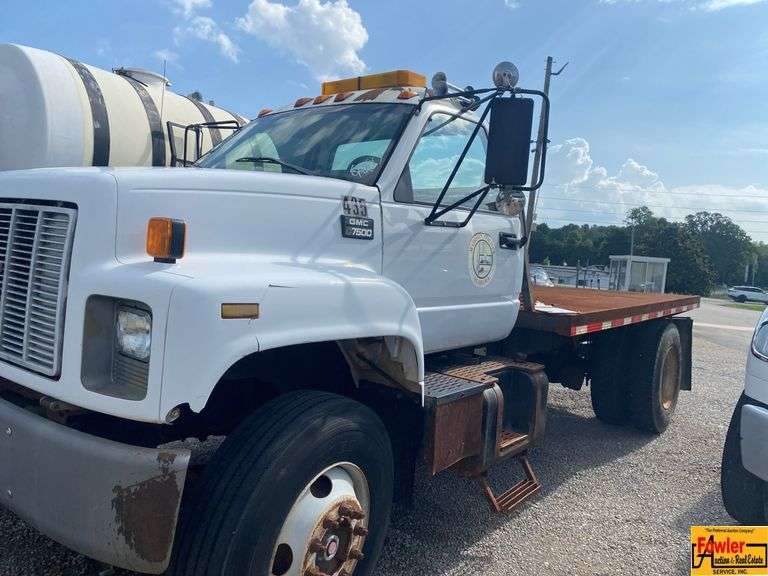 1999 GMC 7500 Flatbed Truck; 80,634 Miles; VIN 1GDM7H1C0XJ505041. See video. image