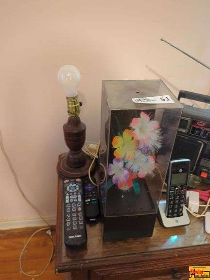 Contents On Nightstand:  Telephone, Remotes, Radio, Lamp, and Decor Lot image
