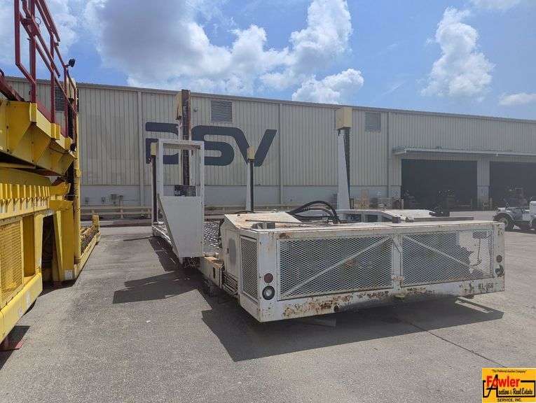Aircraft Cargo Loader to be viewed & picked up at Huntsville's Airport Cargo Yard.  For more information, call Greg Bottom at (256) 777-4496.  Buyer is completely responsible for dismantling & moving. image