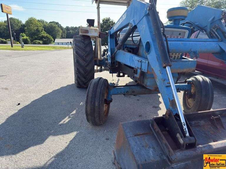 Ford 7000 Tractor with Woods DuAl loader & hay fork attachment. 3,355 hrs.  Runs good.  See video.
