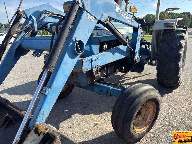 Ford 7000 Tractor with Woods DuAl loader & hay fork attachment. 3,355 hrs. Runs good. See video. image