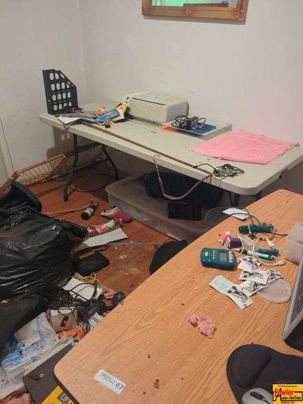 Contents Of Room:  display case, folding tables, printer, display monitor with mouse