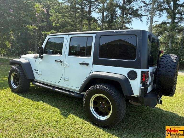 2016 Jeep Sport Wrangler Unlimited 4x4, Hard top & doors come off; Unlimited Sport Trail Rated; Only 48,000 Miles; VIN 1C4BJWDG4GL200498.  Seller offering 3-month/3,000 mile warranty.  Located at 7255 Highway 53 in Harvest, AL.  Call 601-513-7691 for more information. image