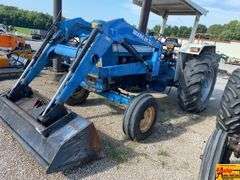 Ford 7000 Tractor with Woods DuAl loader & hay fork attachment. 3,355 hrs.  Runs good.  See video.
