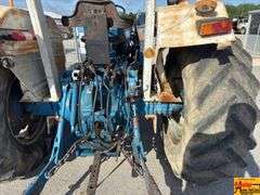 Ford 7000 Tractor with Woods DuAl loader & hay fork attachment. 3,355 hrs.  Runs good.  See video.
