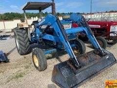 Ford 7000 Tractor with Woods DuAl loader & hay fork attachment. 3,355 hrs.  Runs good.  See video.