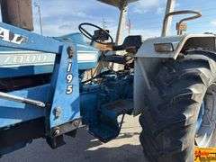 Ford 7000 Tractor with Woods DuAl loader & hay fork attachment. 3,355 hrs.  Runs good.  See video.