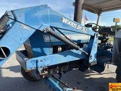 Ford 7000 Tractor with Woods DuAl loader & hay fork attachment. 3,355 hrs.  Runs good.  See video.
