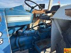 Ford 7000 Tractor with Woods DuAl loader & hay fork attachment. 3,355 hrs.  Runs good.  See video.