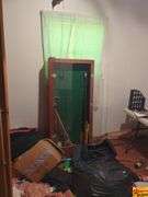 Contents Of Room:  display case, folding tables, printer, display monitor with mouse