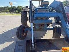 Ford 7000 Tractor with Woods DuAl loader & hay fork attachment. 3,355 hrs.  Runs good.  See video.