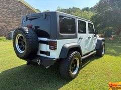 2016 Jeep Sport Wrangler Unlimited 4x4, Hard top & doors come off; Unlimited Sport Trail Rated; Only 48,000 Miles; VIN 1C4BJWDG4GL200498.  Seller offering 3-month/3,000 mile warranty.  Located at 7255 Highway 53 in Harvest, AL.  Call 601-513-7691 for more information.